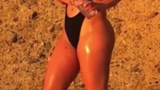 Laci Kay Somers Reveals Busty Beachside Oiling